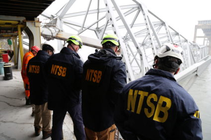 NTSB investigators work on the cargo vessel Dali, which struck and collapsed the Francis Scott Key Bridge, in Baltimore