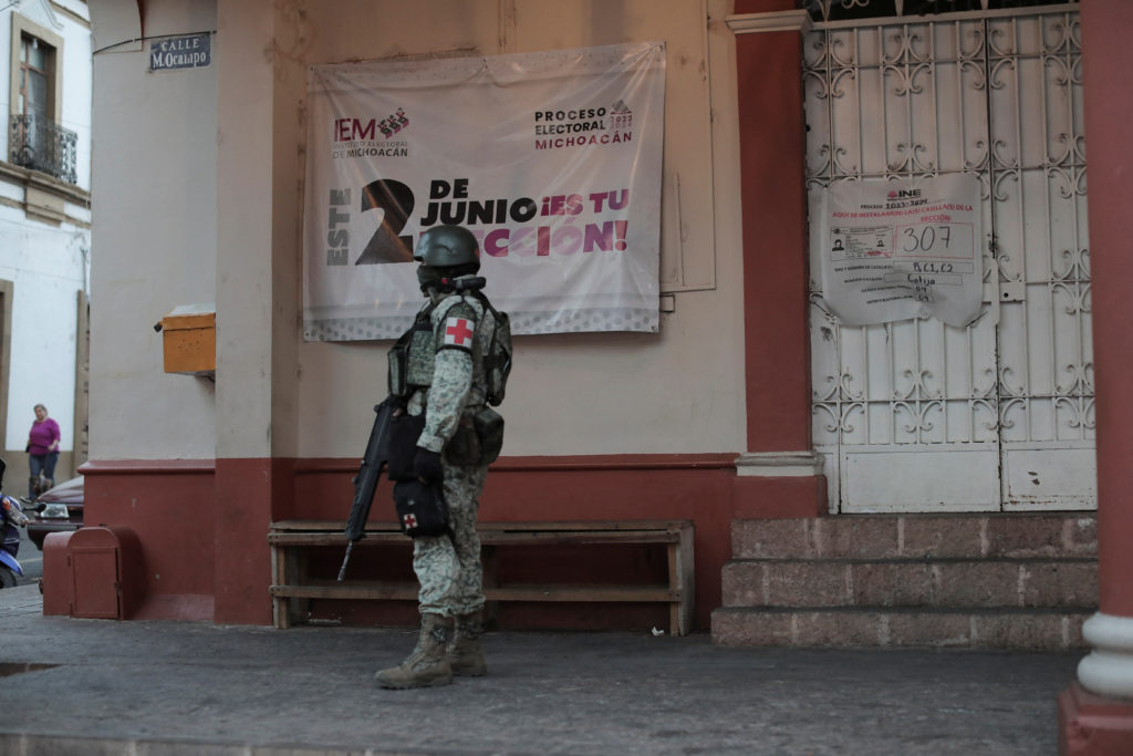 Security forces guard polling stations, in Cotija