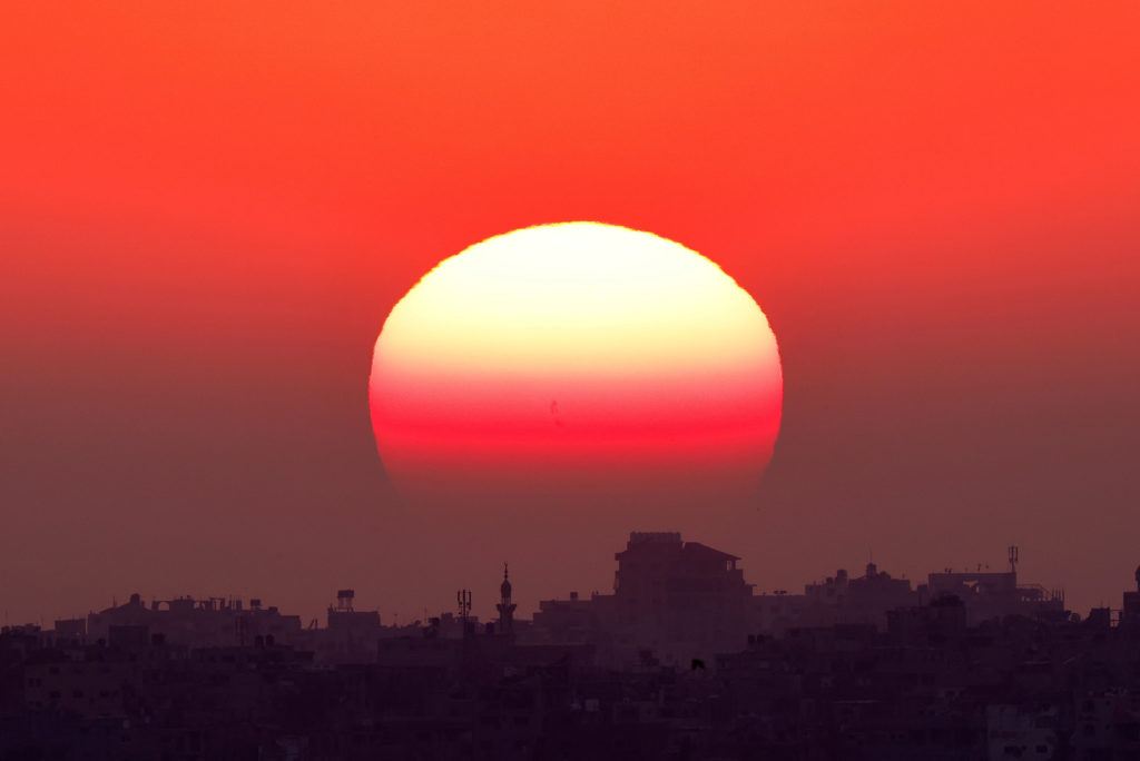 The sun sets over the Gaza Strip, amid the ongoing conflict between Israel and Hamas, as seen from Israel, June 5, 2024. A...