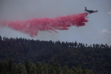 Wildfires continue to blaze in New Mexico village, but cooler temps and rain could help corral wildfire