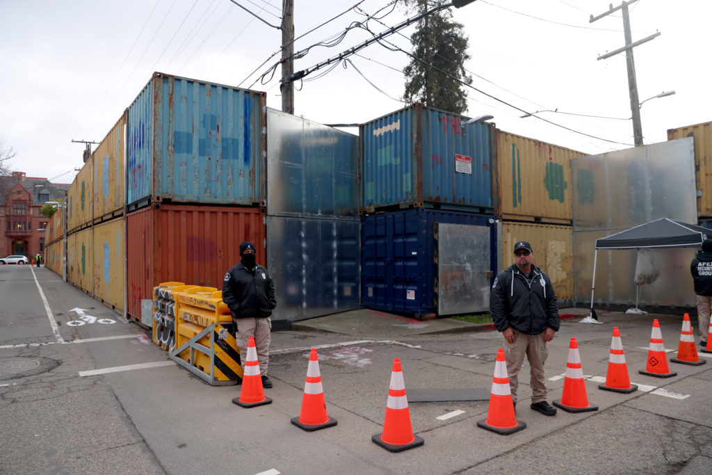 Security teams are stationed outside of Peoples Park in Berkeley, Calif., on Tuesday, Jan. 23, 2023. UC Berkeley has surrounded the park with shipping containers and hired full-time security to keep people out while waiting for court approval to build student housing there. Photo by Jane Tyska/Digital First Media/East Bay Times via Getty Images