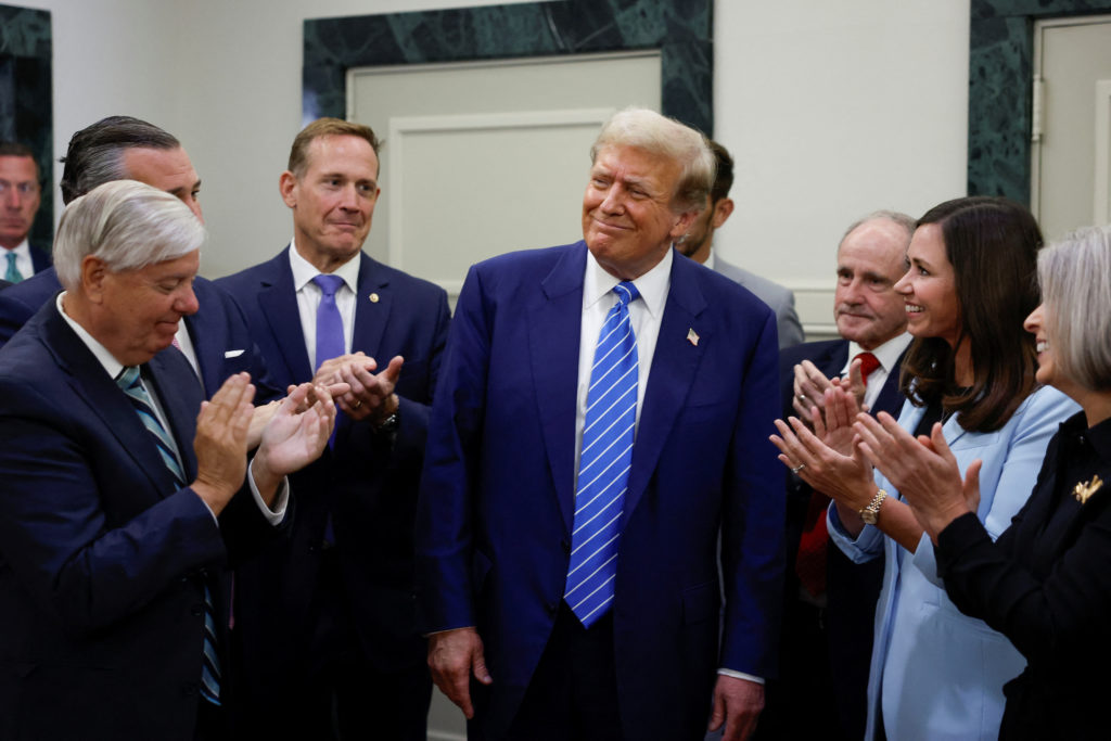 Republican presidential candidate Trump speaks to the media following meetings with Republicans on Capitol Hill, in Washin...