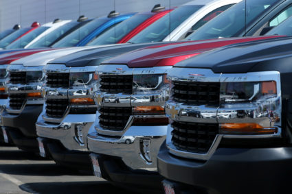New trucks are shown for sale at a Chevrolet dealership in National City, California
