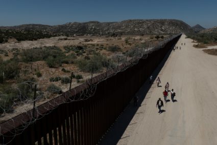 Asylum-seeking migrants enter the United States from Mexico in Jacumba Hot Springs