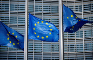 FILE PHOTO: European Union flags fly outside the European Commission headquarters in Brussels