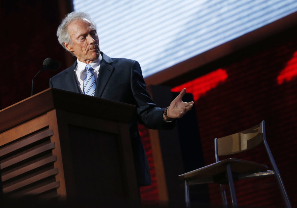Actor Clint Eastwood addresses an empty chair during the final session of the Republican National Convention in Tampa
