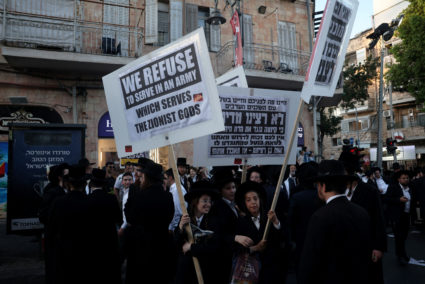 Protest against an Israeli Supreme Court ruling requiring the state to begin drafting ultra-Orthodox Jewish seminary stude...
