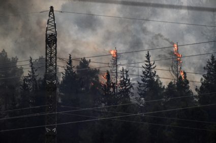 Fires blaze after Lebanon's Hezbollah said it launched more than 200 rockets and a swarm of drones at Israeli military sit...