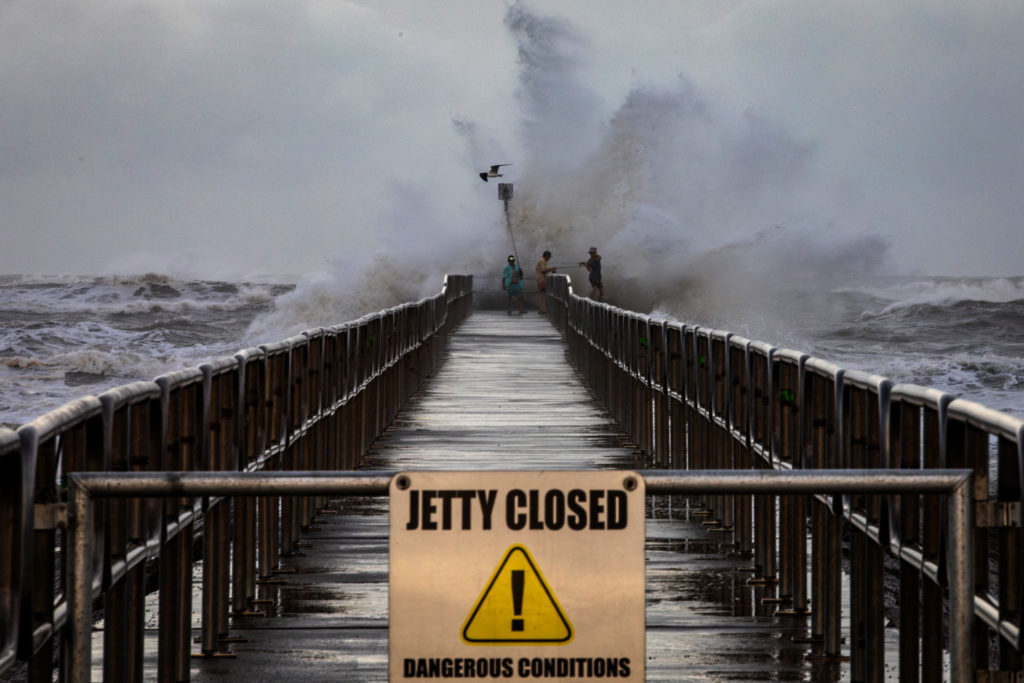 Fishermen from Orange Grove fish off the Packery Channel Jetty during Tropical Storm Beryl