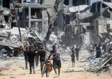 Emergency crews recover bodies in Gaza City as negotiations continue in Egypt