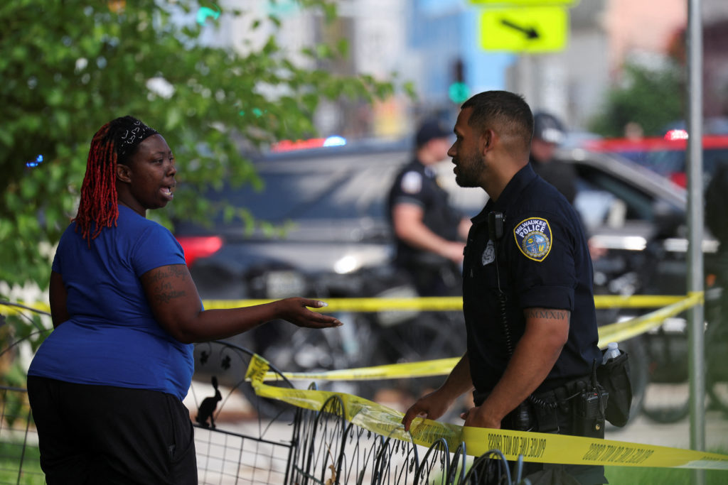 Emergency personnel work at the site of a police shooting near the RNC, in Milwaukee