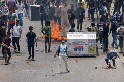 Anti-quota supporters clash with police and Awami League supporters at the Rampura area in Dhaka