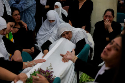 Families whose children were killed at a soccer pitch by a rocket launched across Lebanon's border with Israel react in Ma...