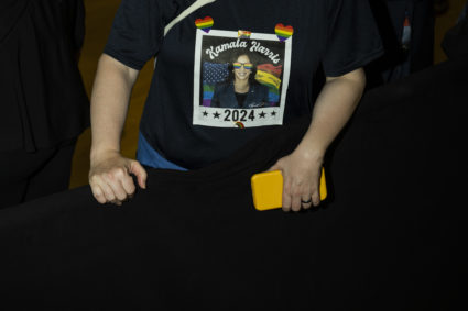 An attendee wears a Kamala Harris shirt during a campaign event
