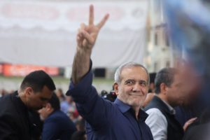 Iran's President-elect Masoud Pezeshkian gestures during a gathering with his supporters at the shrine of Iran's late lead...