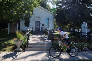 A boy bicycles past the "Birthplace of the Republican Party" in Ripon