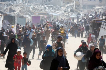 Palestinians flee the eastern parts of Khan Younis after Israeli evacuation order, in the southern Gaza Strip