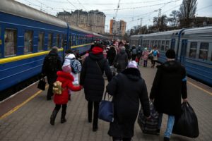 Civilians fleeing Russia's invasion of Ukraine prepare to board an evacuation train, in Odesa