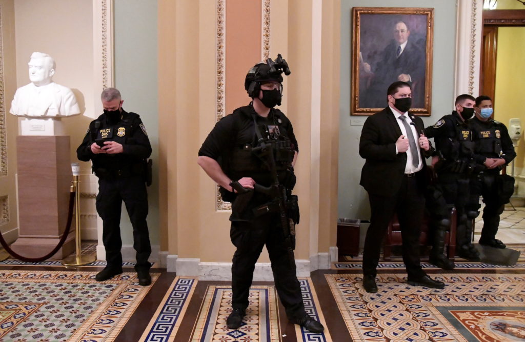 Security is upgraded in aftermath of Trump supporters breeching the US Capitol