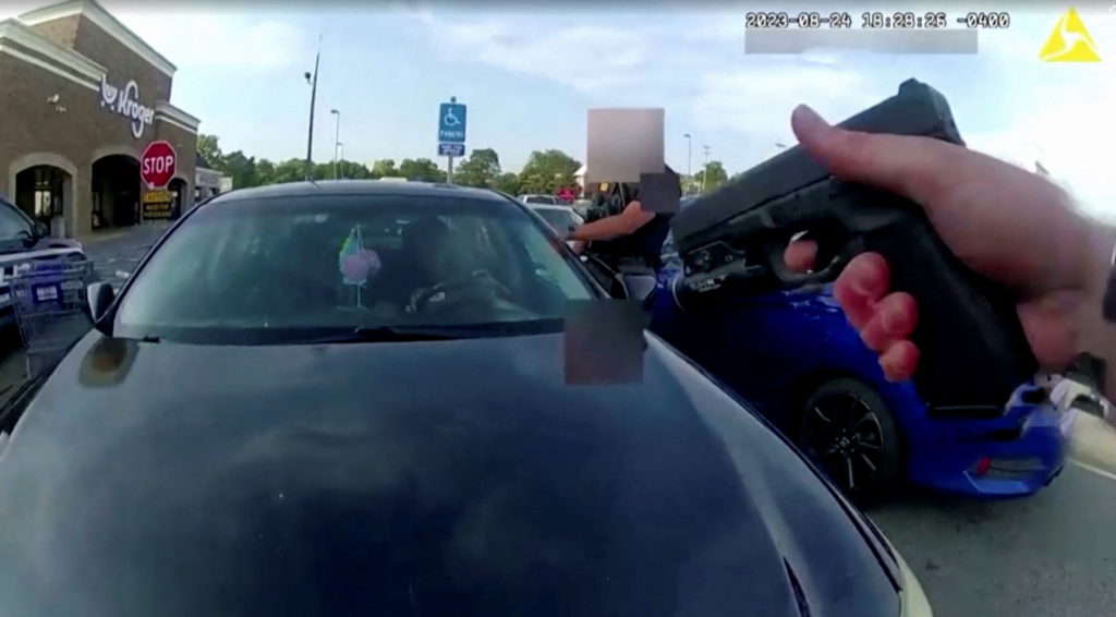 Screen capture obtained from a body camera footage showing an officer fatally shooting a pregnant Black woman in the parki...
