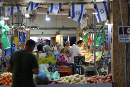 People shop in a market, amid rising tensions between Israel and Hezbollah, in Haifa