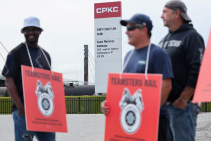 Striking Teamsters union workers picket in Port Coquitlam