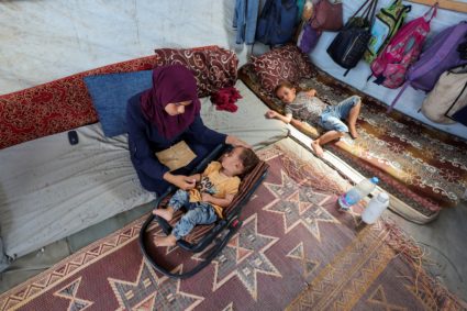 The mother of Palestinian boy Abdul Rahman Abu Al-Jidyan, who is the first person to contract polio in Gaza in 25 years, l...