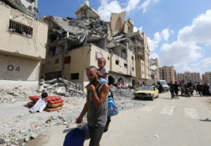 Displaced Palestinians make their way as they flee Hamad City following an Israeli evacuation order, in Khan Younis in the...