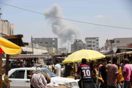 Displaced Palestinians make their way as they flee the eastern part of Khan Younis