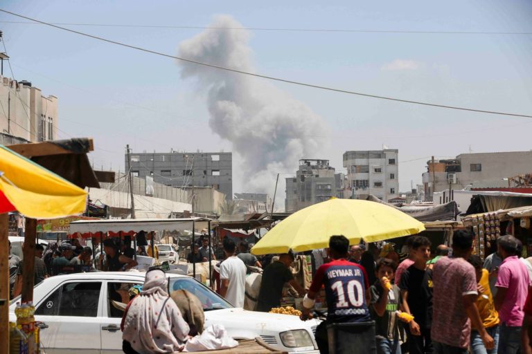 Displaced Palestinians make their way as they flee the eastern part of Khan Younis