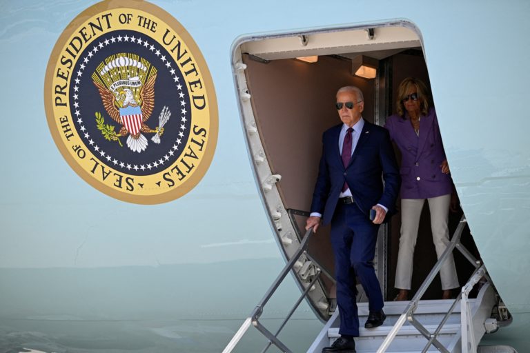 U.S. President Joe Biden and first lady Jill Biden disembark Air Force One, on their way to the Democratic National Conven...