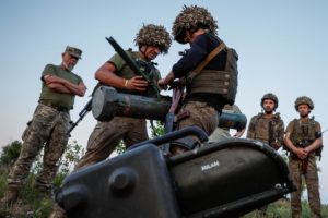 Ukrainian service members attend military drills near a frontline in Donetsk region