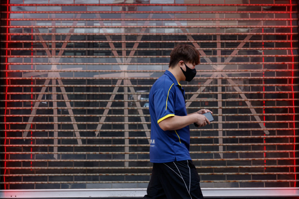 A window is taped in anticipation of typhoon Yagi at a boutique in Hong Kong