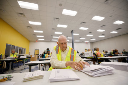 Election worker prepares absentee ballots in Raleigh