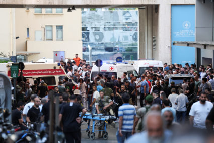 People gather outside a hospital, as more than 1,000 people, including Hezbollah fighters and medics, were wounded on Tues...