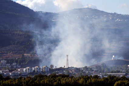 Smoke rises above Kiryat Shmona after rockets were fired from Lebanon towards Israel, amid cross-border hostilities betwee...