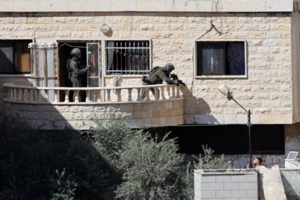 Israeli soldiers take part in a military raid, in Qabatya
