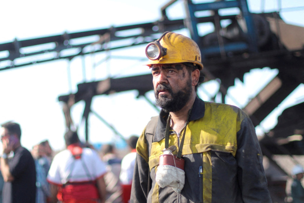 Miners are seen after a gas explosion in a coal mine in South Khorasan Province
