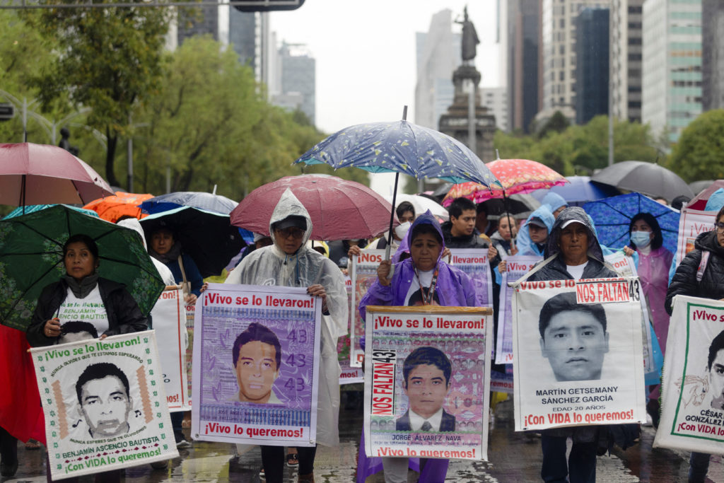 Demonstrators march to demand justice for the disappearance of student teachers in Mexico City