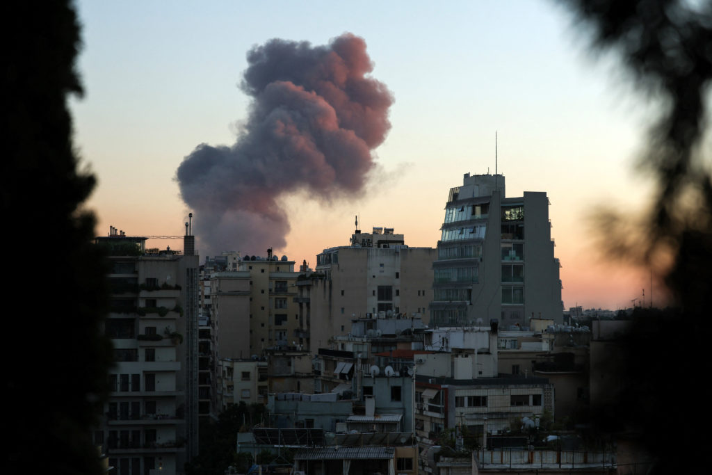 Smoke rises after explosions in Beirut