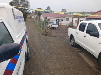 A law enforcement official works at the scene of a mass shooting in Lusikisiki