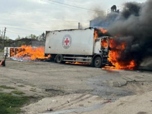 Cargo truck of the International Committee of the Red Cross burns after a Russian military strike in the village of Viroli...