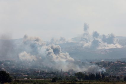 Smoke billows over southern Lebanon following Israeli strikes, as seen from Tyre, southern Lebanon