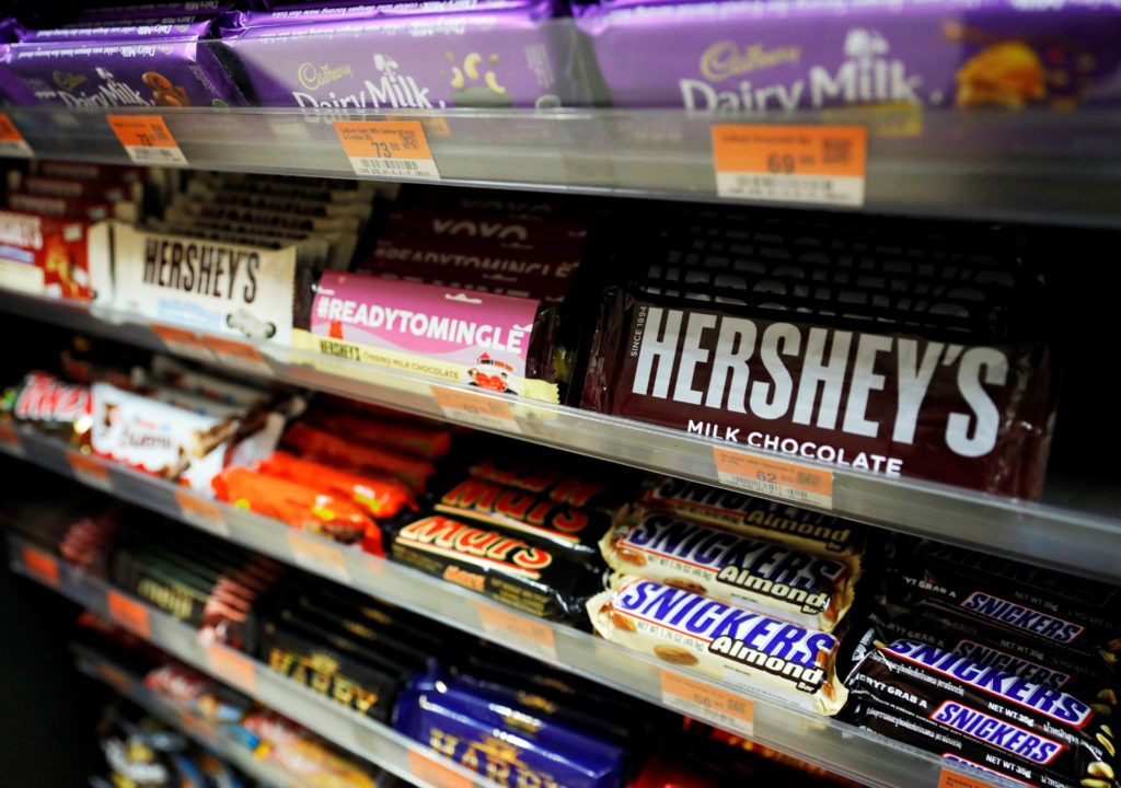 Different brands of chocolate bars are stored in racks at a supermarket in Quezon City
