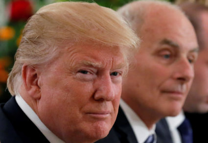 U.S. President Trump flanked by Secretary of State Pompeo and White House Chief of Staff Kelly attend a lunch with Singapo...