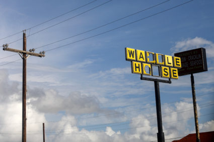 A damaged Waffle House sign is seen in the aftermath of Hurricane Laura in Orange, Texas
