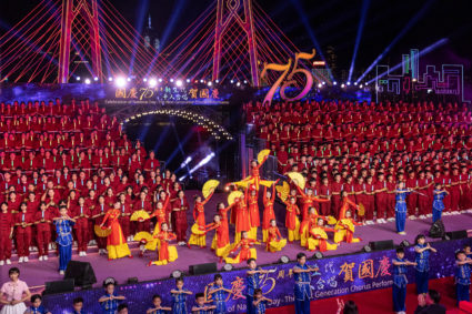 Around 1,000 students sing patriotic songs at an event to celebrate the 75th anniversary of China's National Day in Hong Kong