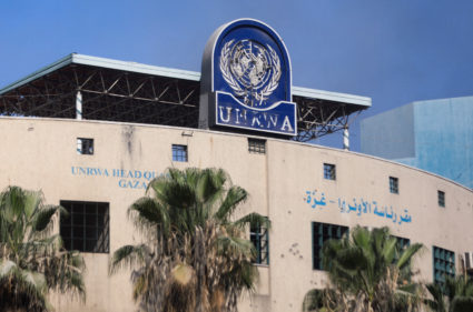 FILE PHOTO: Palestinians gather to inspect the damages at the headquarters of UNRWA in Gaza City