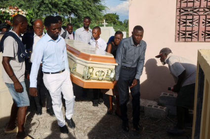 Funeral held for a man killed in Haiti gang massacre