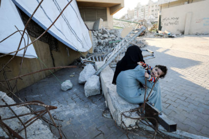 Displaced Palestinians take shelter in a stadium, in Gaza City